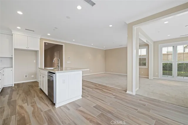 a kitchen with a sink and a stove top oven