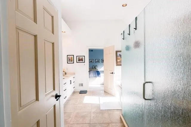 a bathroom with a granite countertop shower