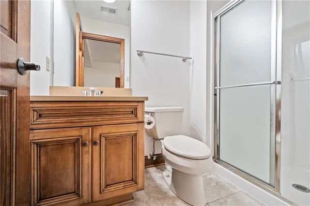 a bathroom with a sink toilet and mirror