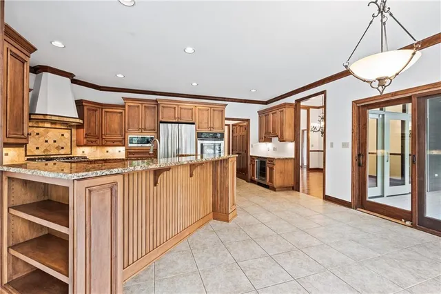 a view of a kitchen with a sink and cabinets