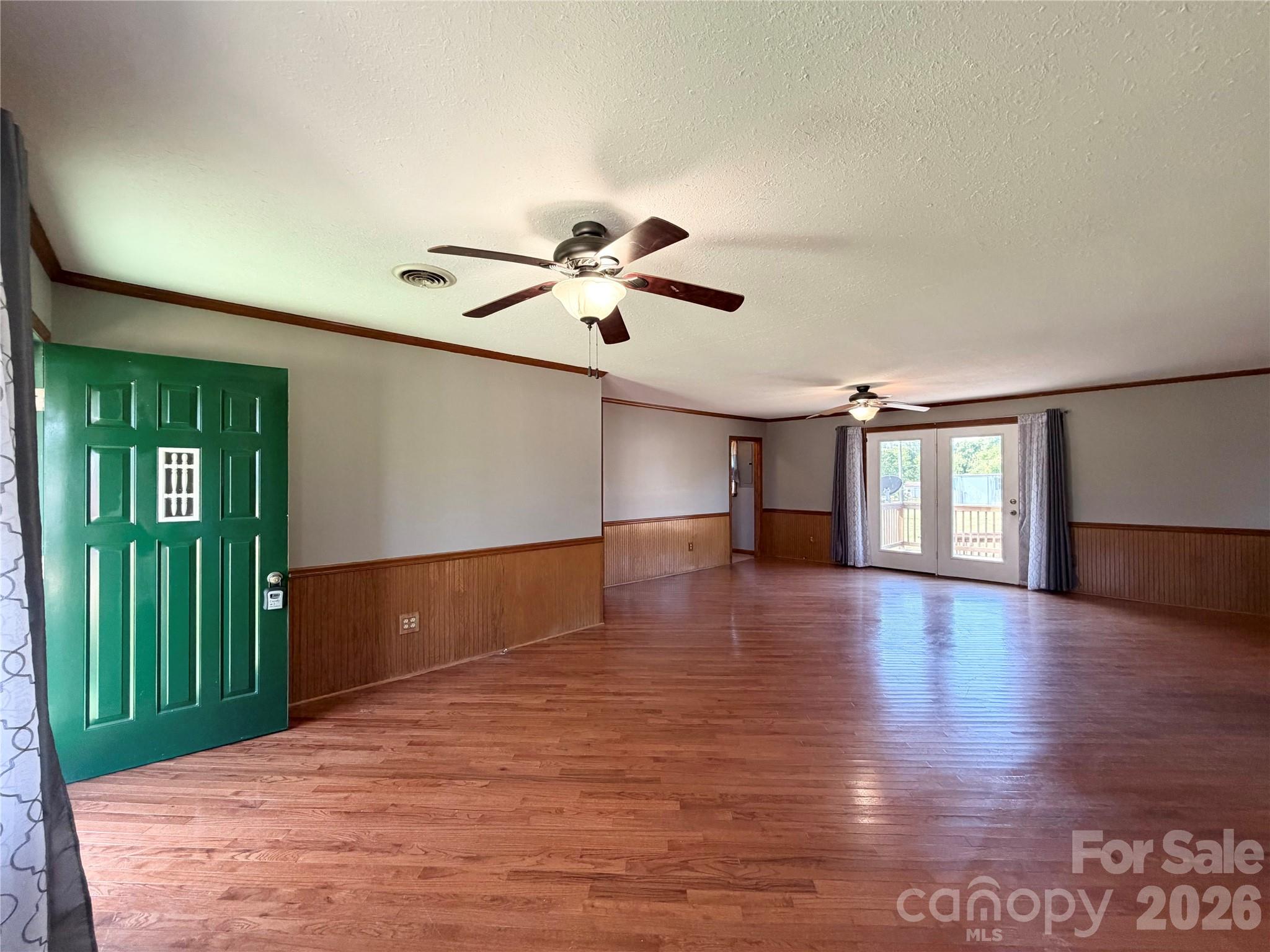 372 Ferry Road Forest City, NC 28043 - Photo 11 of 36 a view of an empty room with window and wooden floor