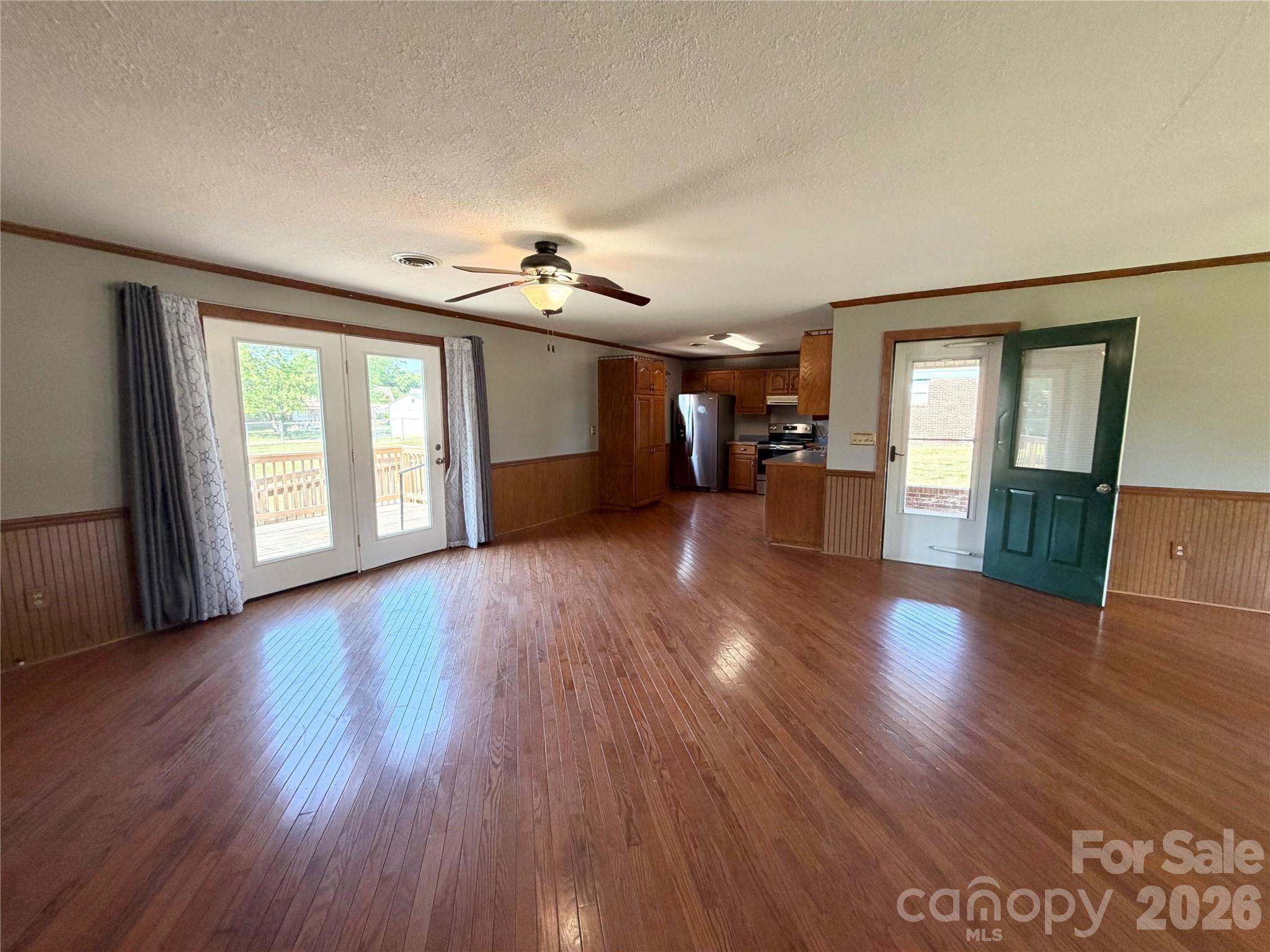 372 Ferry Road Forest City, NC 28043 - Photo 13 of 36 an empty room with wooden floor and windows