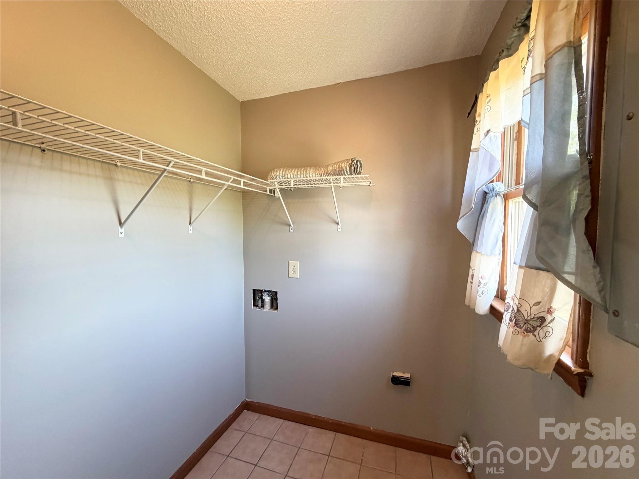 372 Ferry Road Forest City, NC 28043 - Photo 20 of 36 a view of small space with racks on the wall