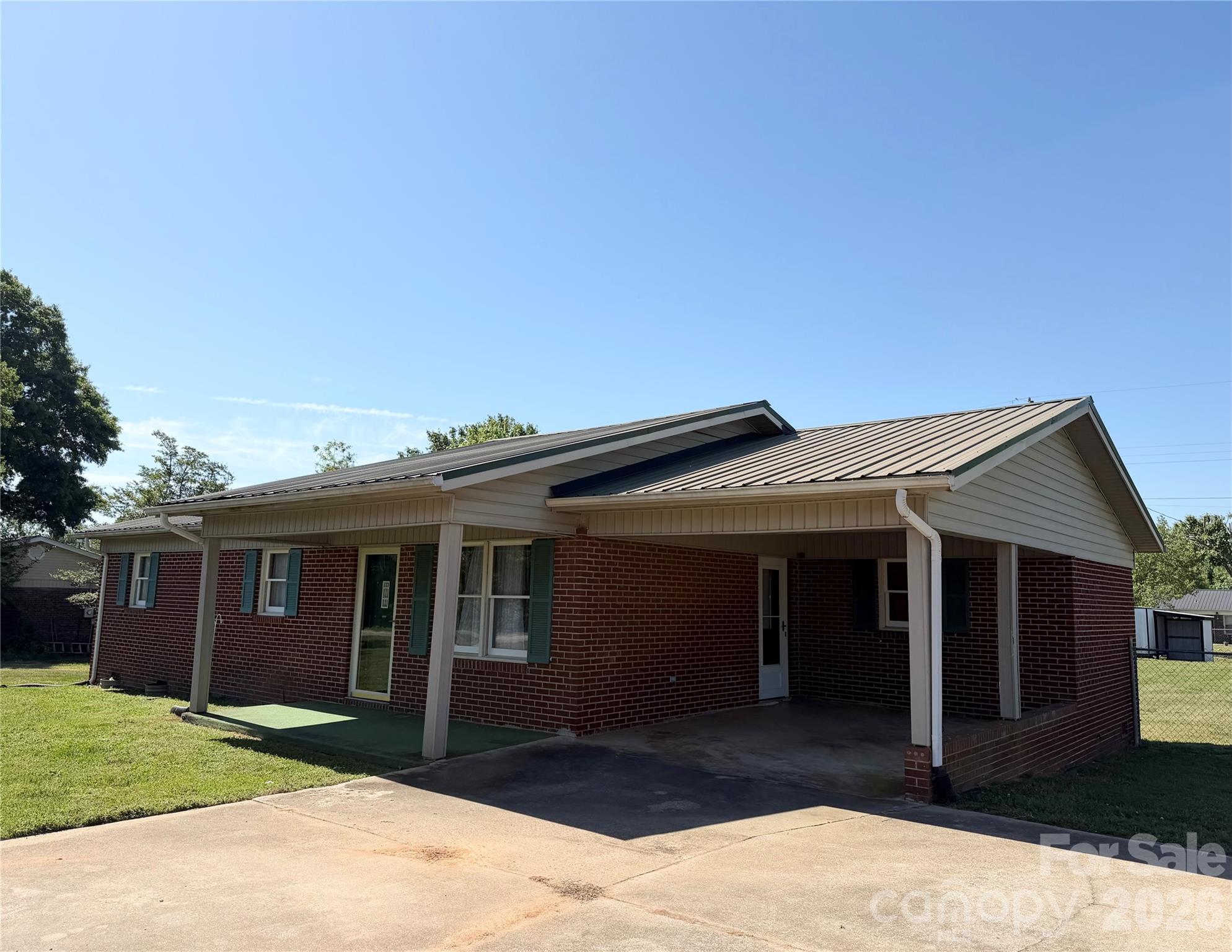372 Ferry Road Forest City, NC 28043 - Photo 21 of 36 a front view of a house with a yard and garage