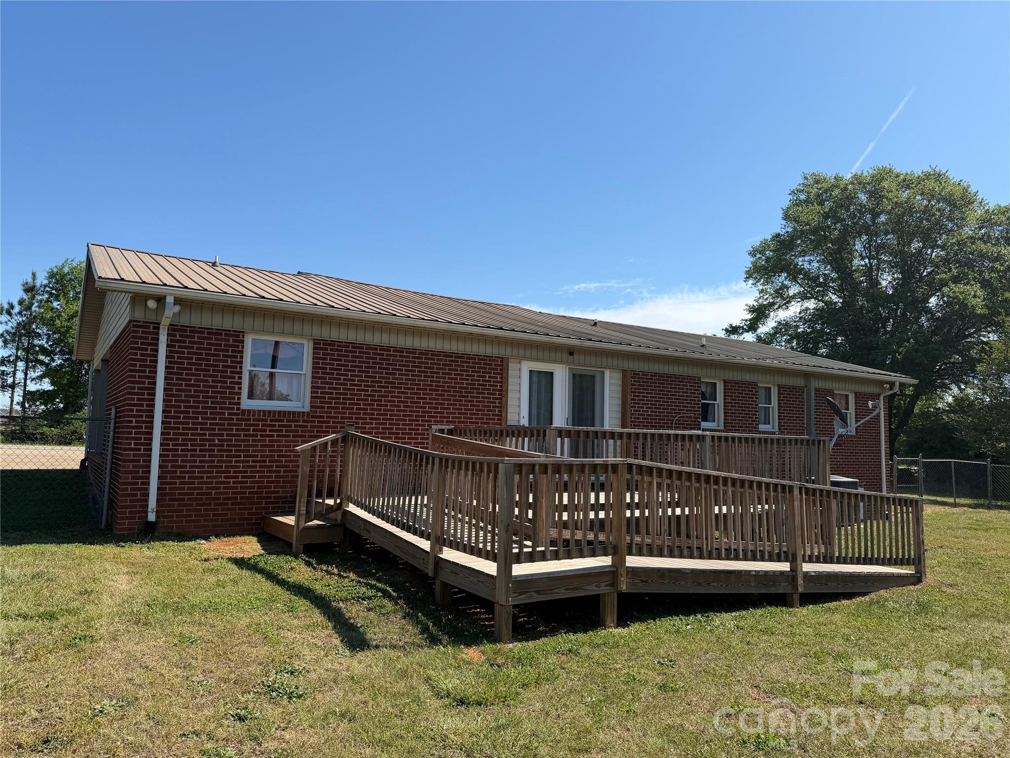 372 Ferry Road Forest City, NC 28043 - Photo 29 of 36 a view of a house with a yard and deck
