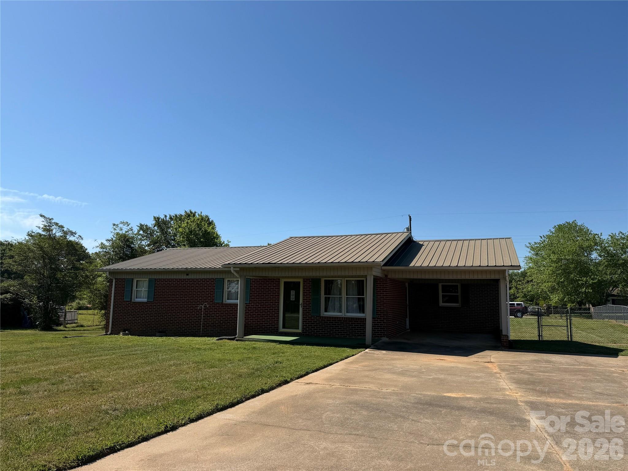 372 Ferry Road Forest City, NC 28043 - Photo 36 of 36 a front view of a house with a garden