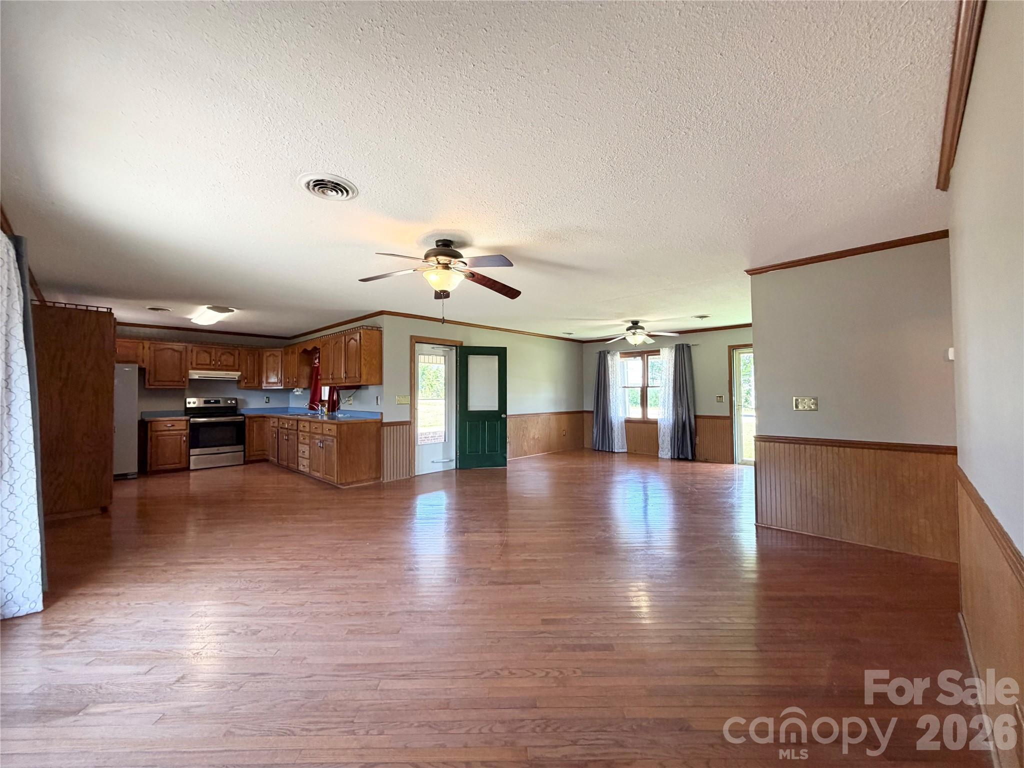 372 Ferry Road Forest City, NC 28043 - Photo 4 of 36 a view of an empty room with wooden floor