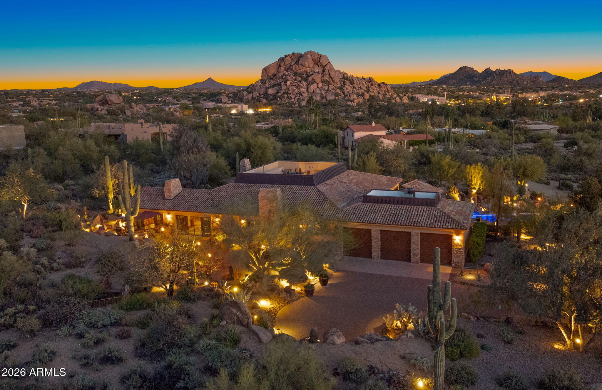 a view of a house with a mountain in the background