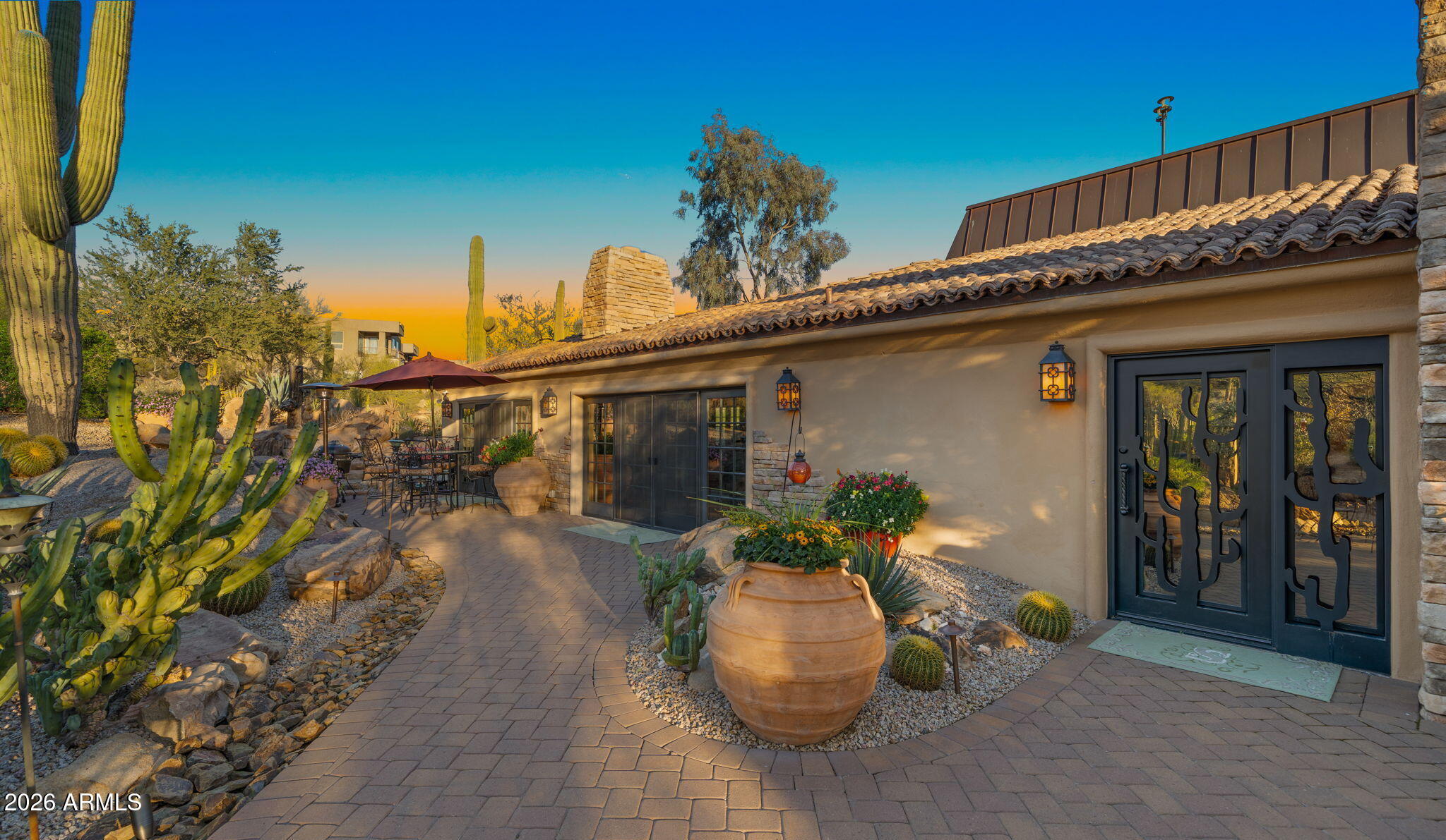 35035 Whileaway Road Carefree, AZ 85377 - Photo 15 of 64 a front view of a house with garden