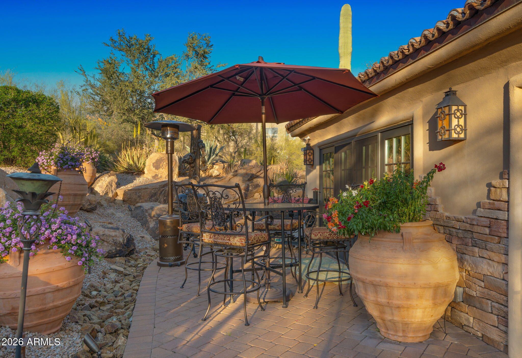 35035 Whileaway Road Carefree, AZ 85377 - Photo 16 of 64 a view of a chair and table in the patio