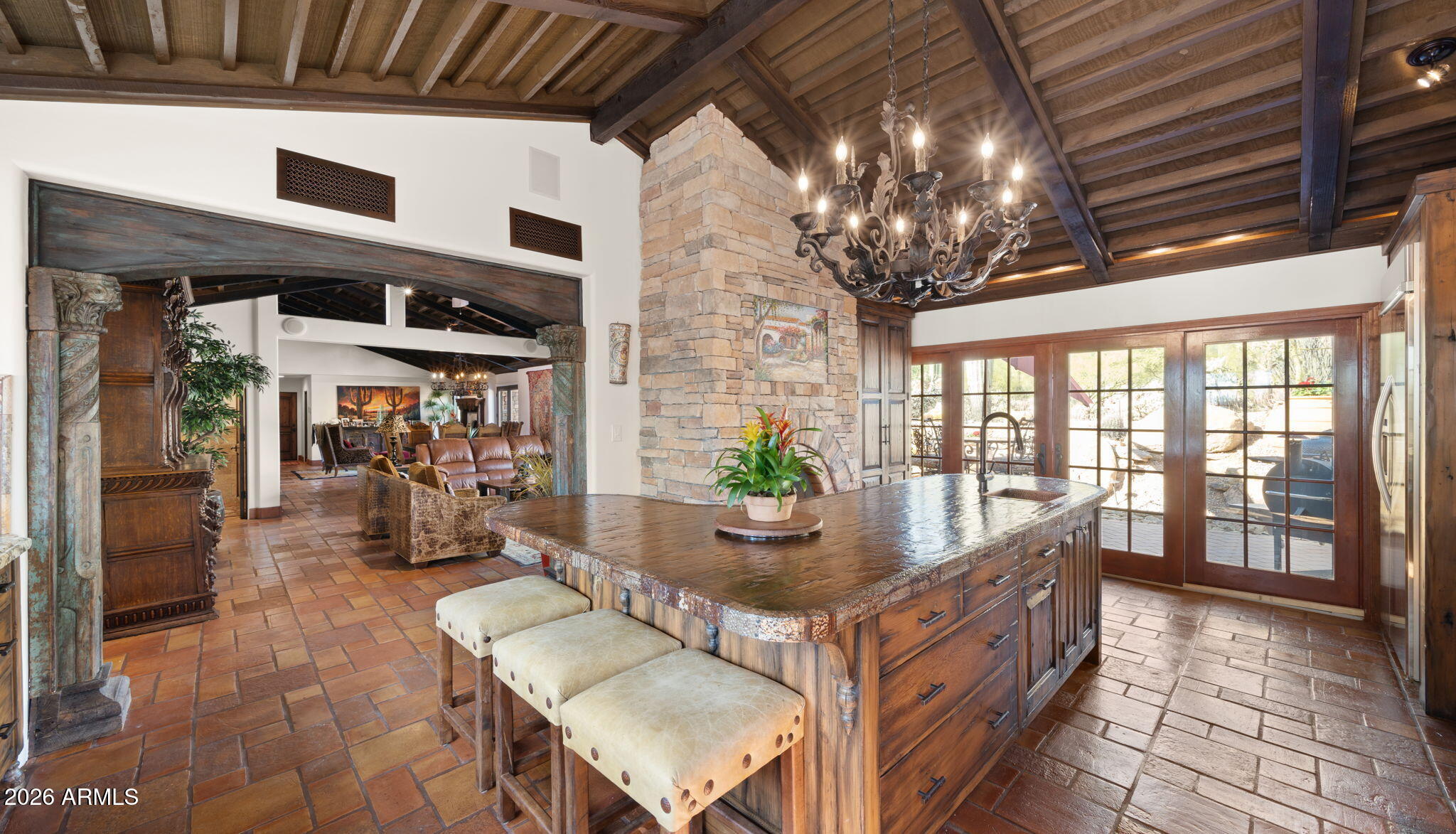 35035 Whileaway Road Carefree, AZ 85377 - Photo 25 of 64 a living room with furniture and a chandelier