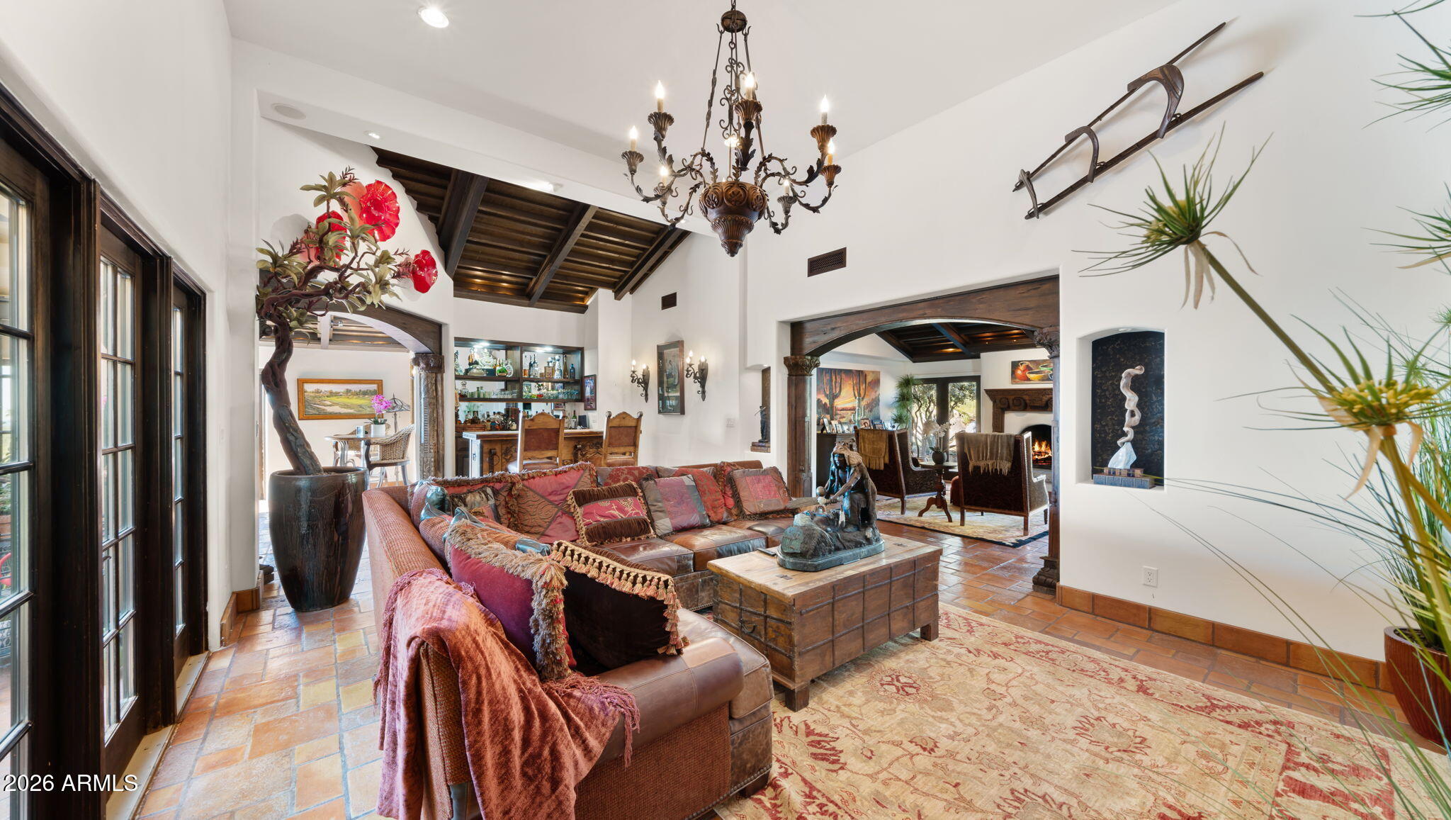 35035 Whileaway Road Carefree, AZ 85377 - Photo 28 of 64 a living room with patio furniture and a chandelier