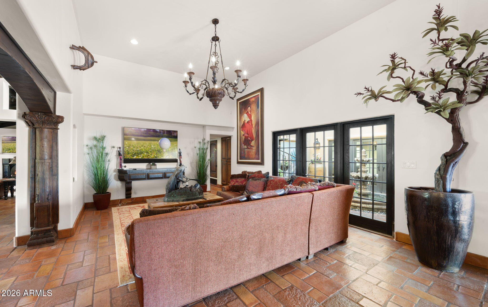 35035 Whileaway Road Carefree, AZ 85377 - Photo 29 of 64 a living room with furniture and a chandelier