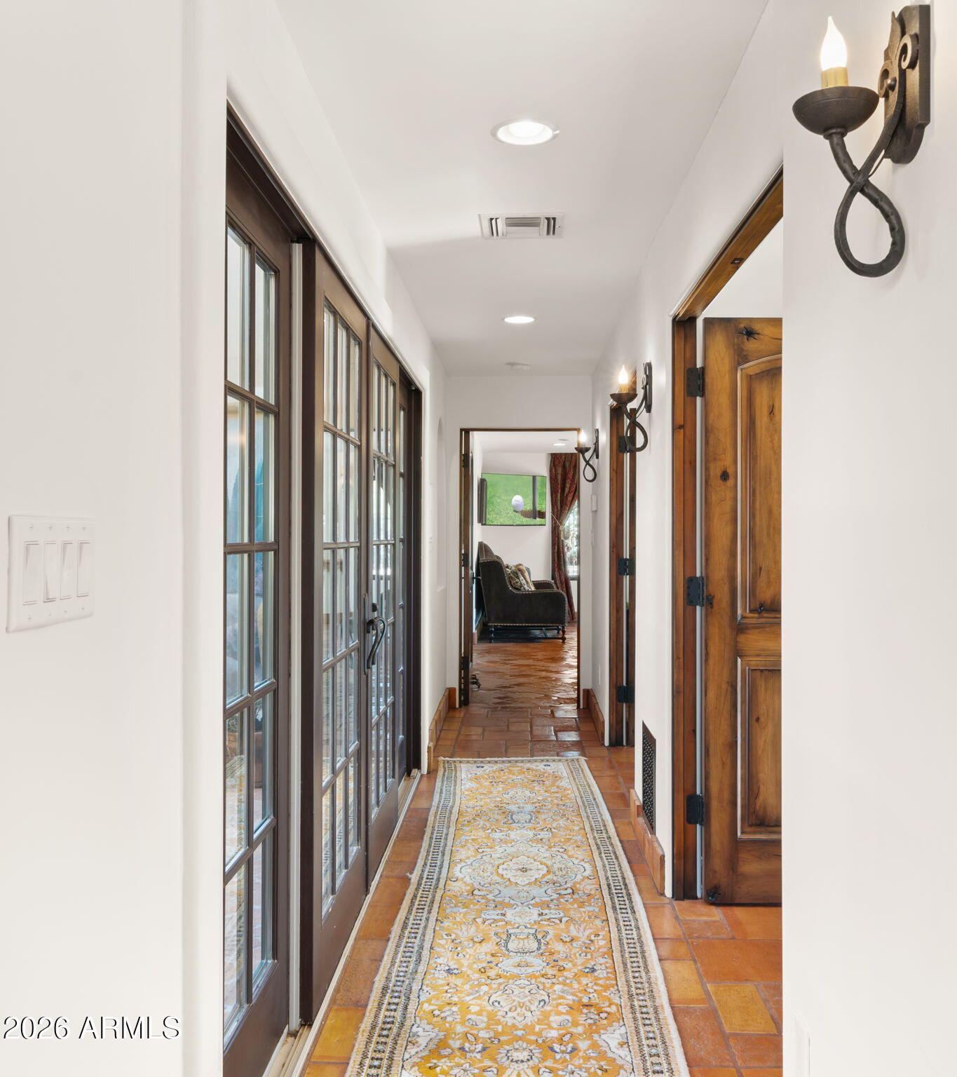 35035 Whileaway Road Carefree, AZ 85377 - Photo 39 of 64 a view of a hallway with wooden floor and a bathroom