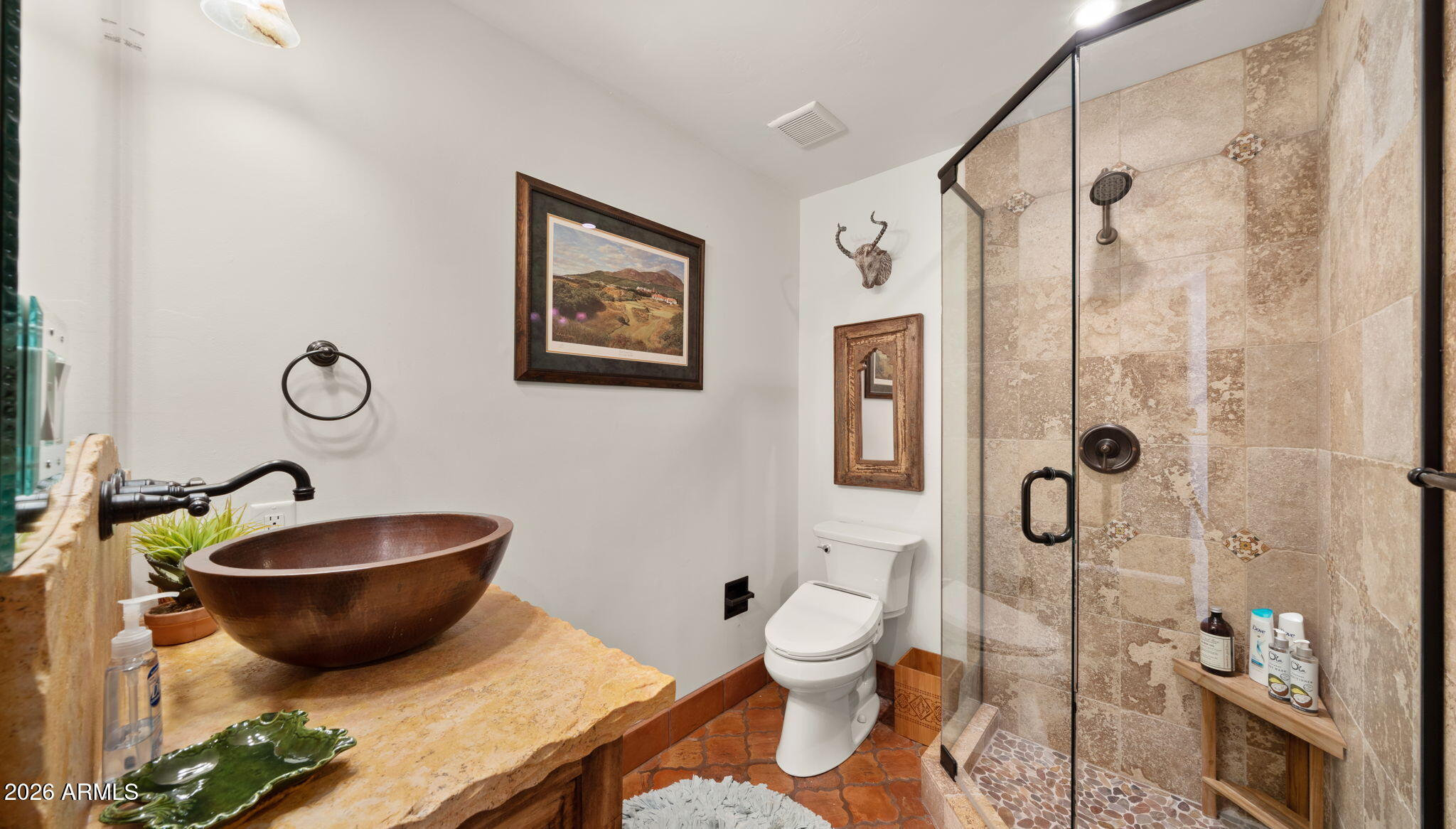 35035 Whileaway Road Carefree, AZ 85377 - Photo 44 of 64 a bathroom with a granite countertop toilet sink and shower