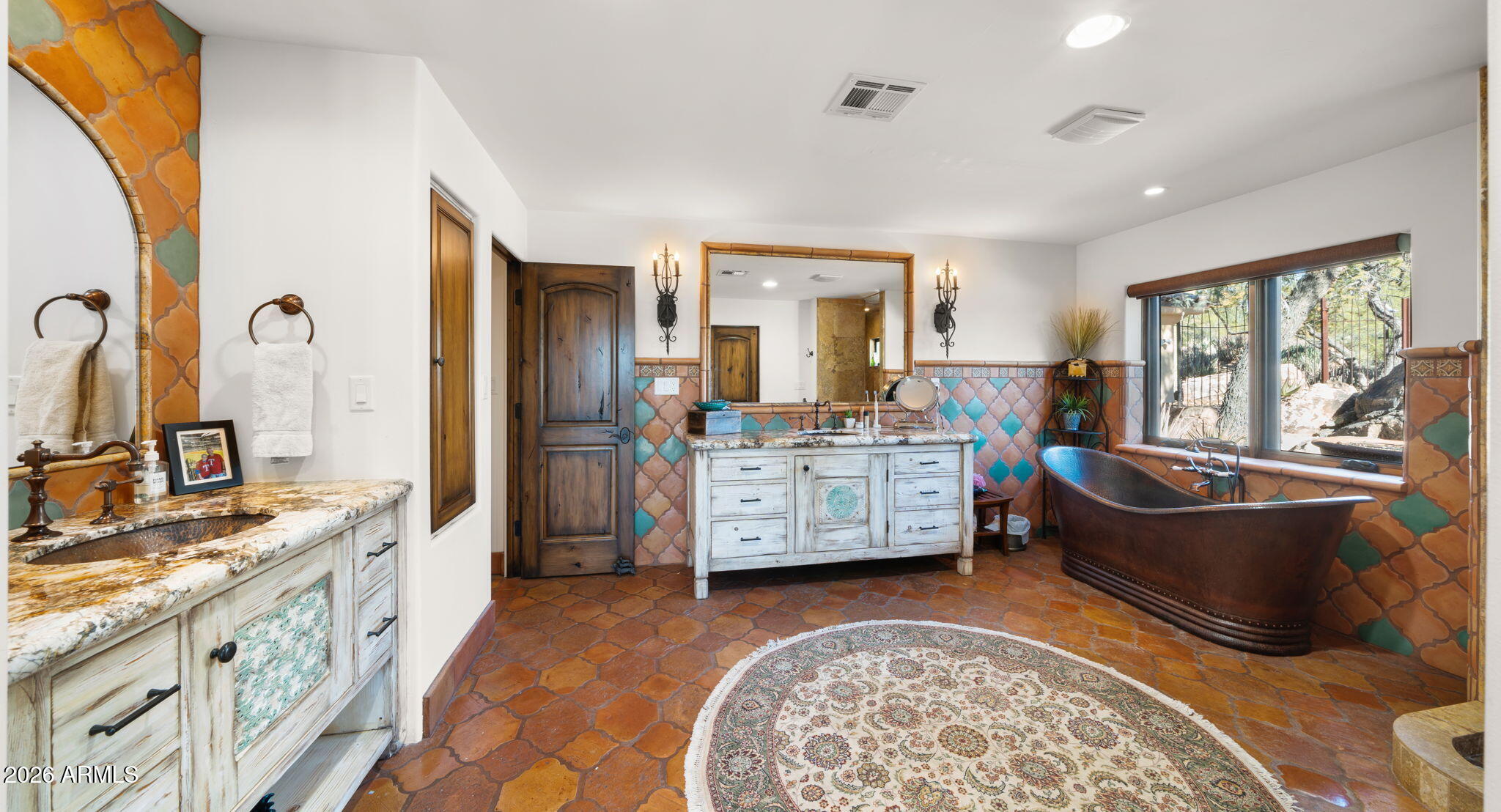 35035 Whileaway Road Carefree, AZ 85377 - Photo 48 of 64 a spacious bedroom with a bed a dresser and large windows