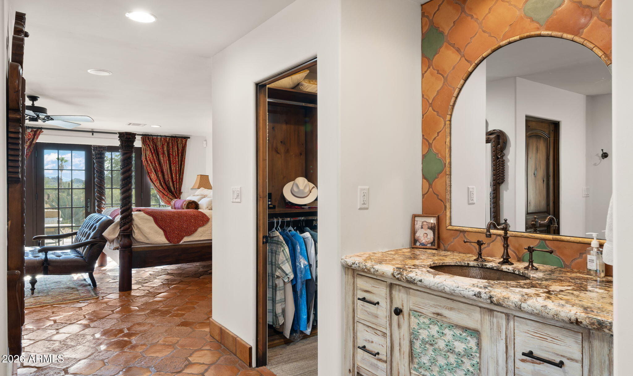 35035 Whileaway Road Carefree, AZ 85377 - Photo 49 of 64 a en suite bathroom with a granite countertop sink and a mirror