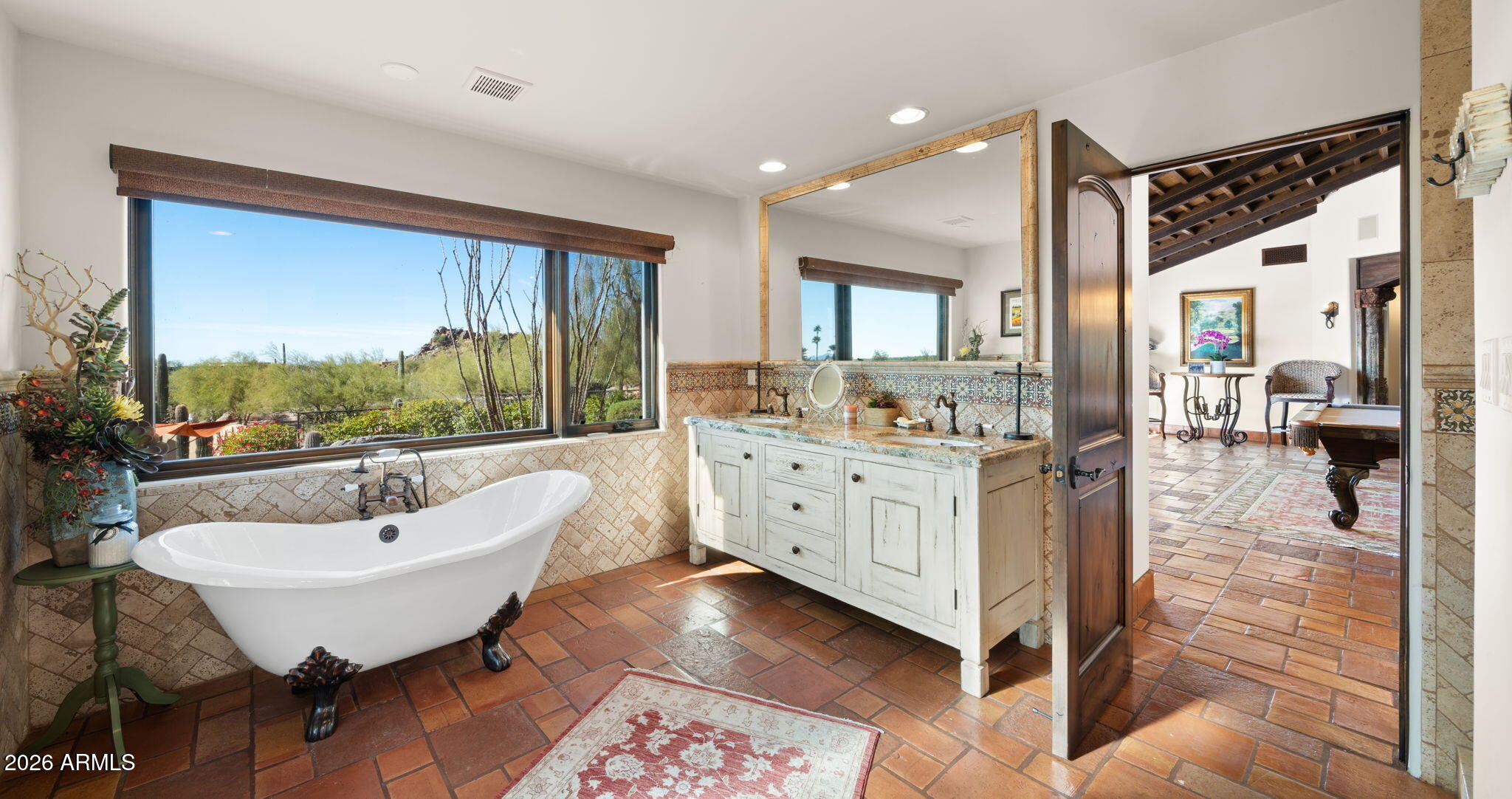 35035 Whileaway Road Carefree, AZ 85377 - Photo 53 of 64 a spacious bathroom with a double vanity sink a mirror and a bathtub