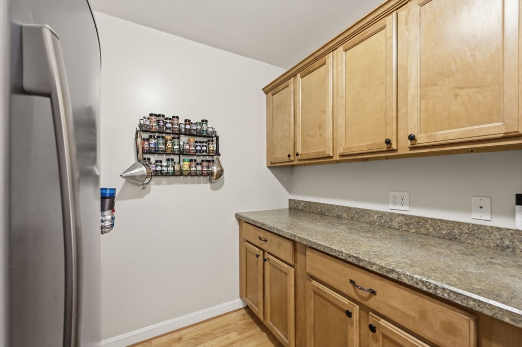 345 Bragg Road Warren, MA 01585 - Photo 19 of 41 a kitchen with stainless steel appliances granite countertop a refrigerator and cabinets