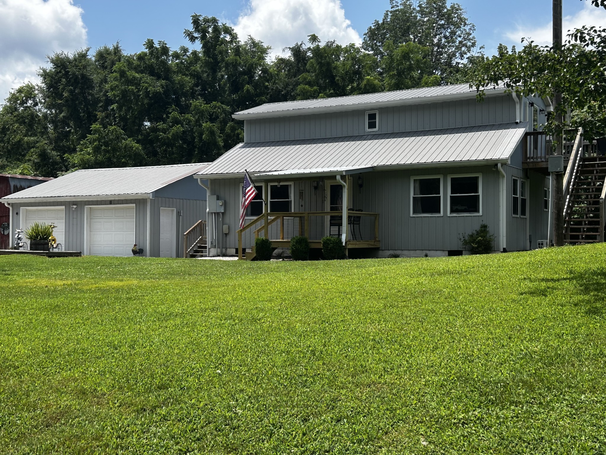 a view of a house with a yard and plants