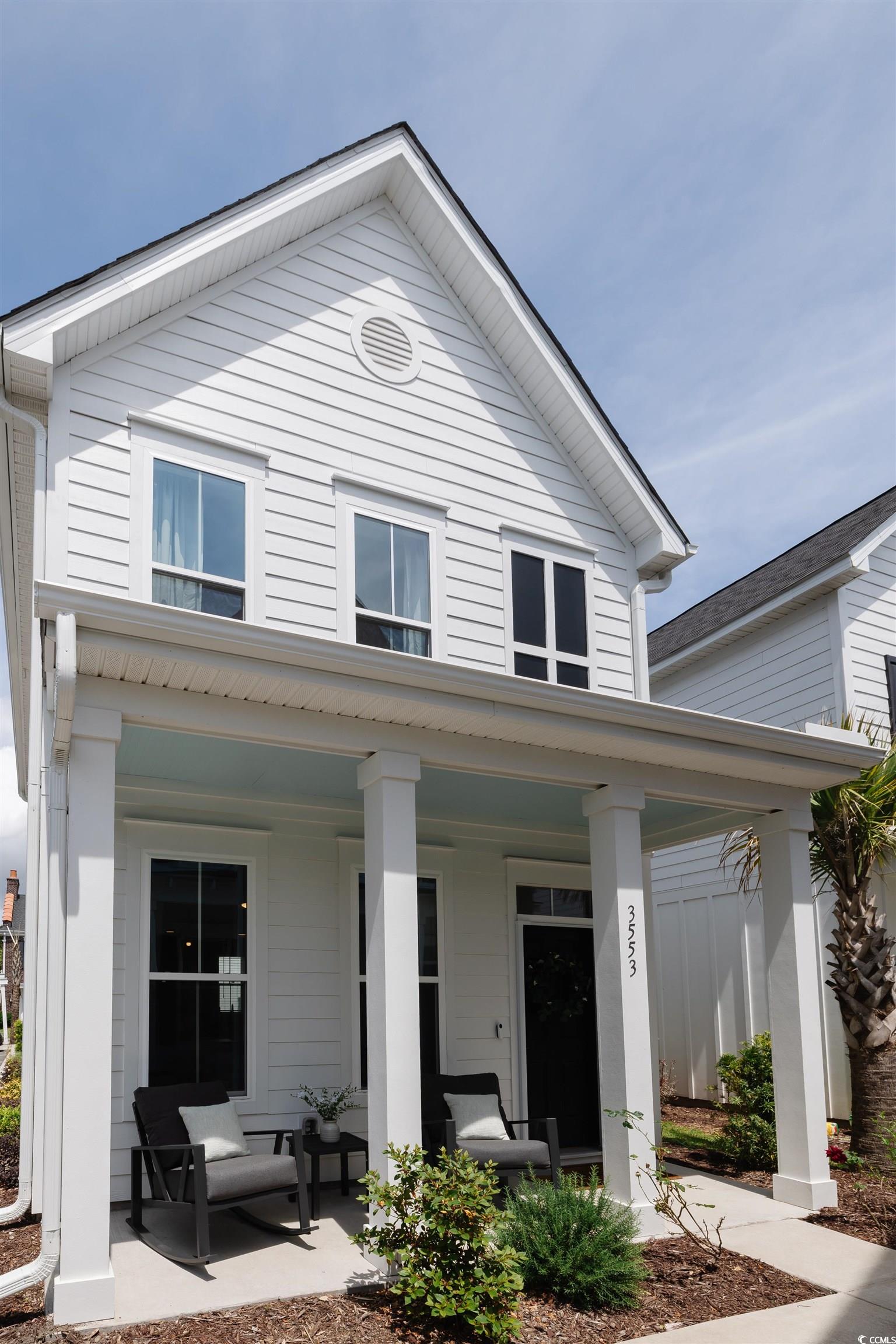 View of front of property with a porch