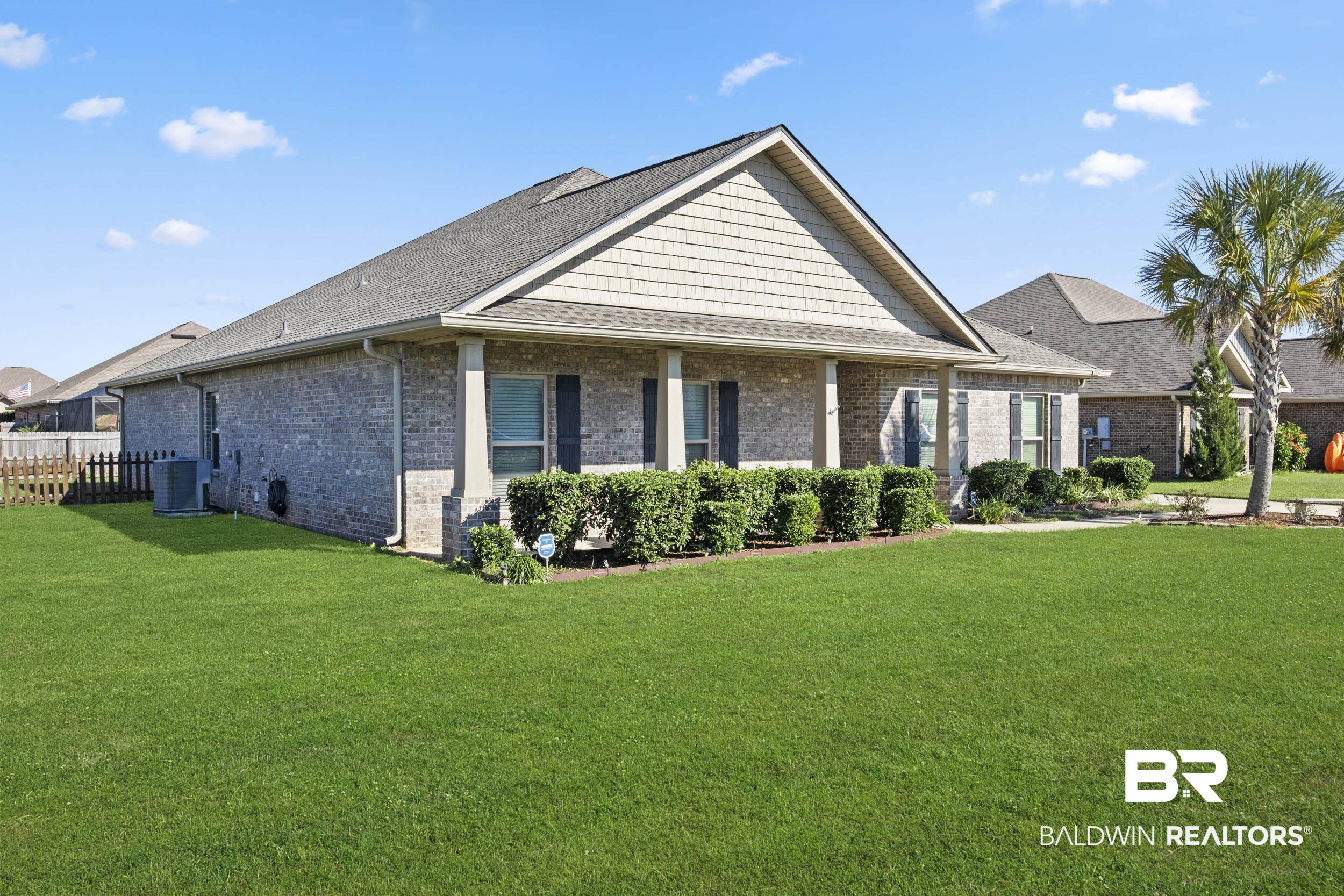 2050 Bourbon Street Foley, AL 36535 - Photo 2 of 32 View of front facade featuring central AC unit and a front yard