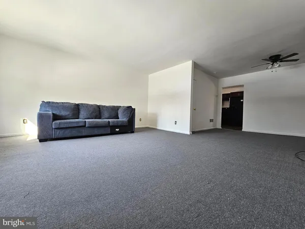 a living room with a couch and a dresser