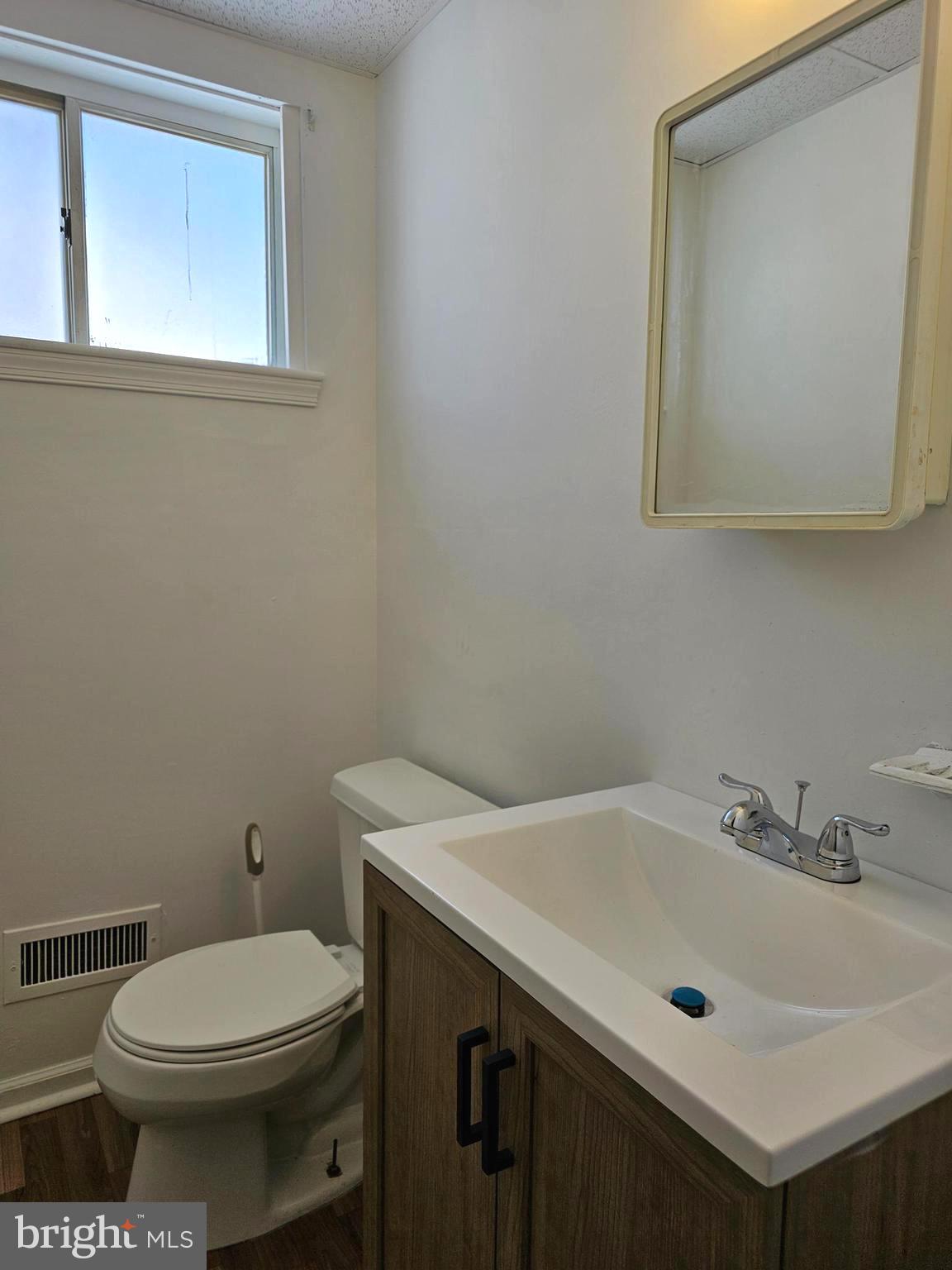531 Pershing Avenue Darby, PA 19023 - Photo 20 of 33 a bathroom with a sink a toilet and mirror