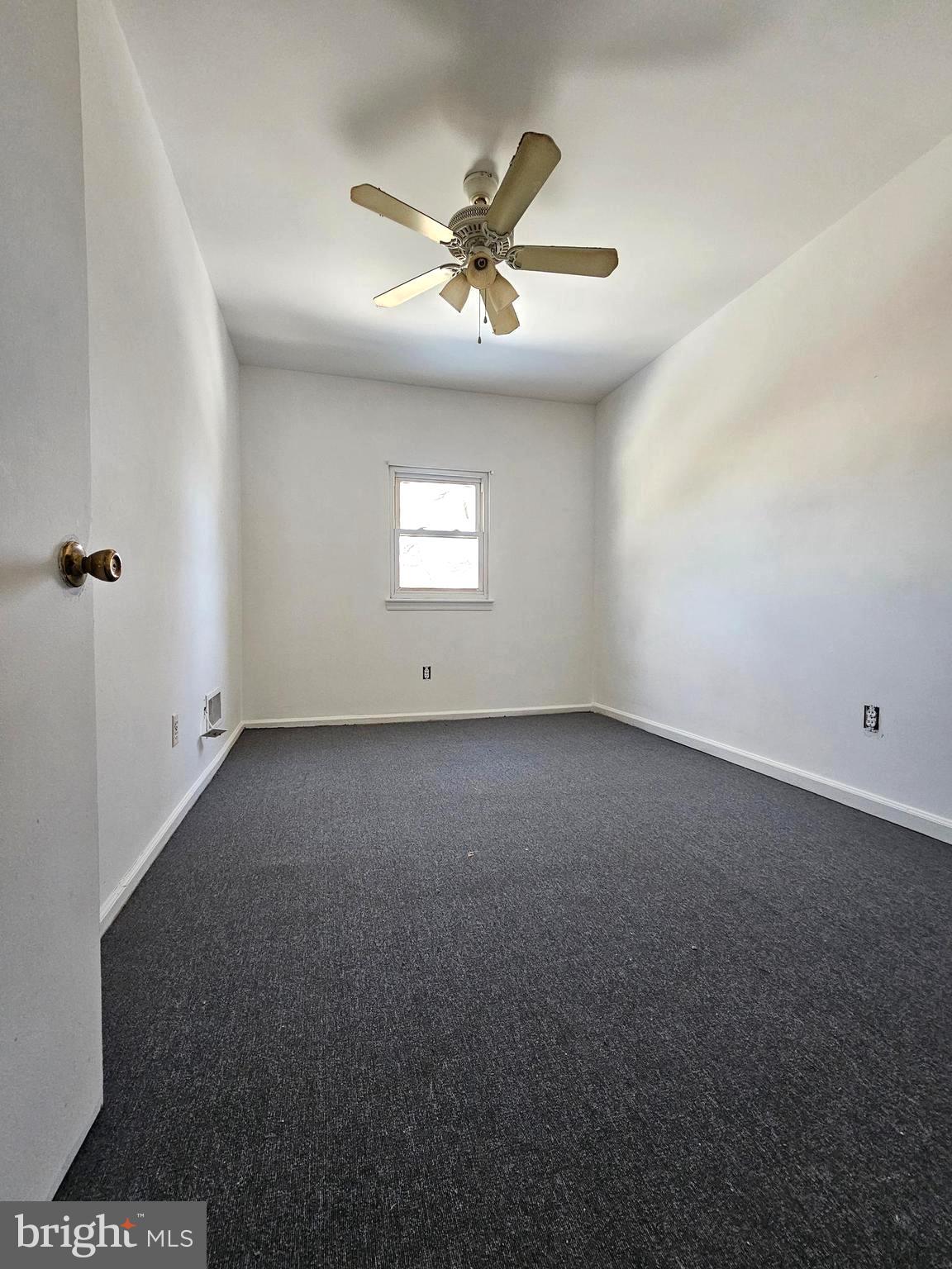 531 Pershing Avenue Darby, PA 19023 - Photo 25 of 33 an empty room with a ceiling fan and window