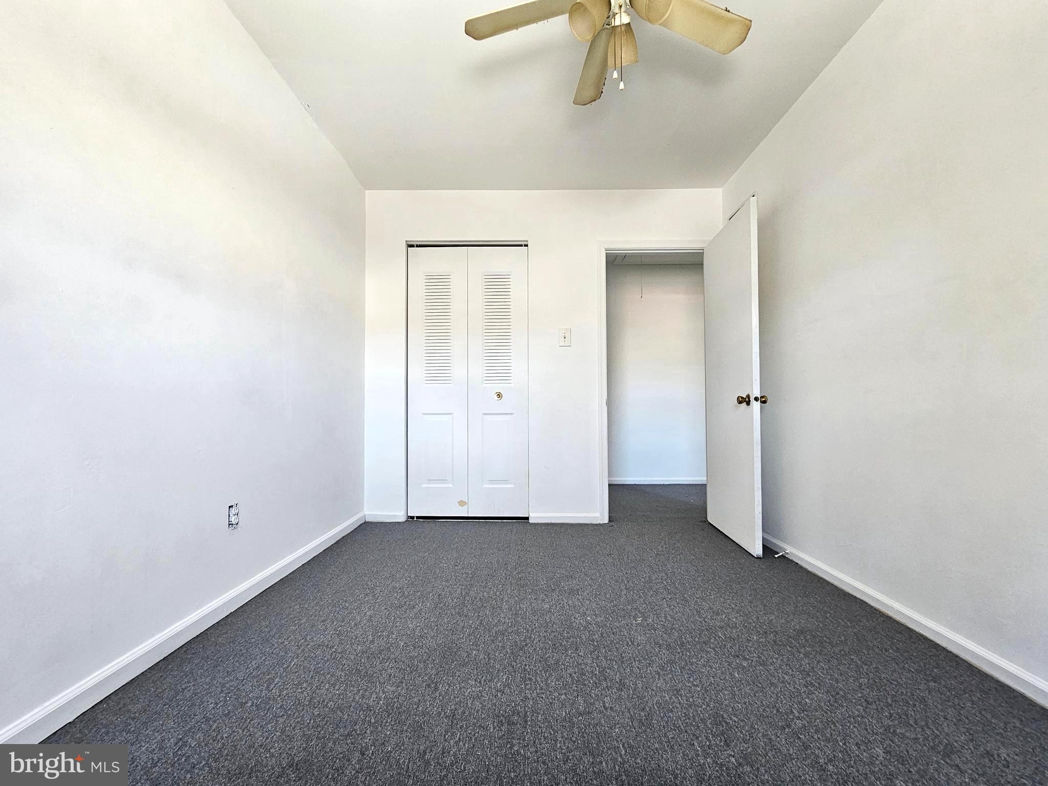 531 Pershing Avenue Darby, PA 19023 - Photo 26 of 33 an empty room with closet and chandelier fan