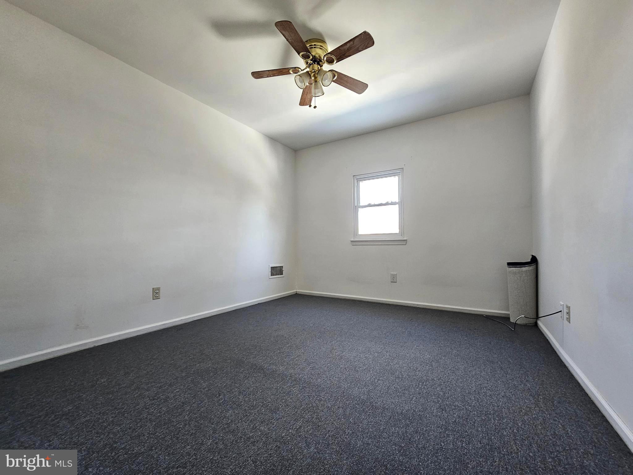 531 Pershing Avenue Darby, PA 19023 - Photo 27 of 33 an empty room with windows and ceiling fan