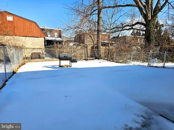 a view of a swimming pool with an outdoor space and seating area