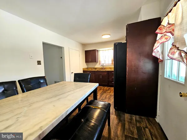 a kitchen with a sink and refrigerator