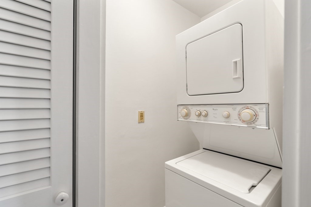 135 Freeman Street, Unit 1A Brookline, MA 02446 - Photo 13 of 22 a utility room with dryer and washer