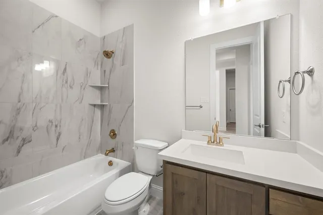 a bathroom with a sink a toilet and a bathtub