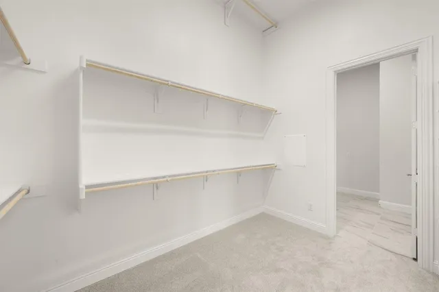 a view of an empty walk in closet