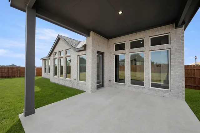 a view of a house with backyard porch and garden
