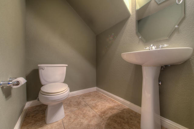 321 Limestone Trail Austin, TX 78737 - Photo 22 of 28 a bathroom with a sink toilet and a mirror