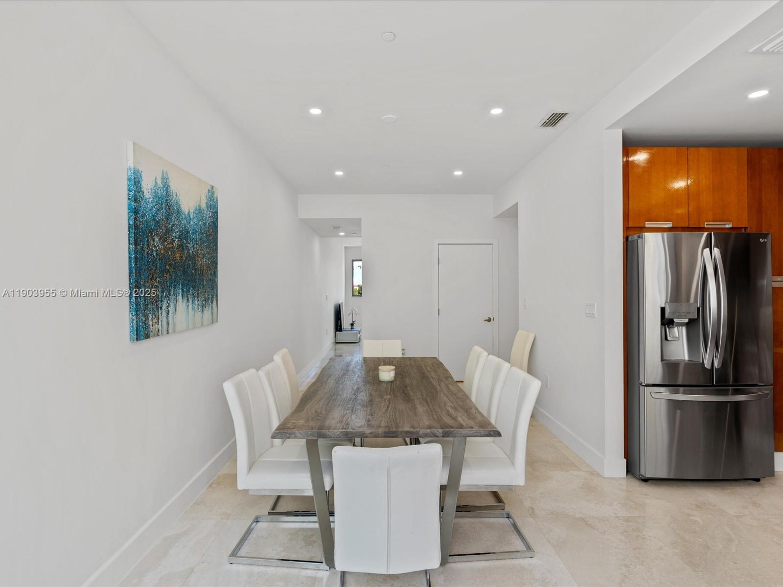 155 North Shore Drive, Unit 1553 Miami Beach, FL 33141 - Photo 12 of 48 a view of a dining room with furniture