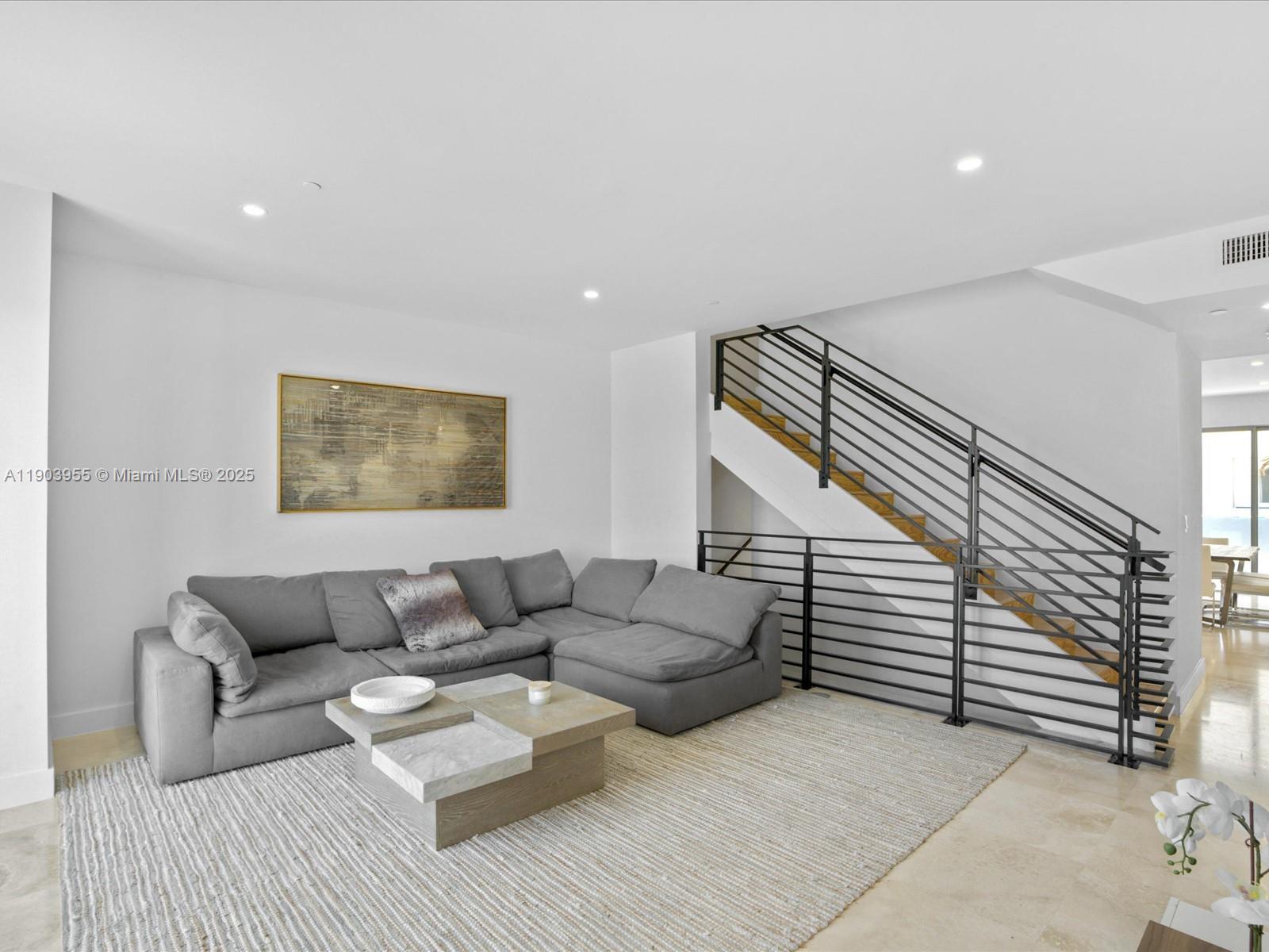 155 North Shore Drive, Unit 1553 Miami Beach, FL 33141 - Photo 18 of 48 a living room with furniture and white walls