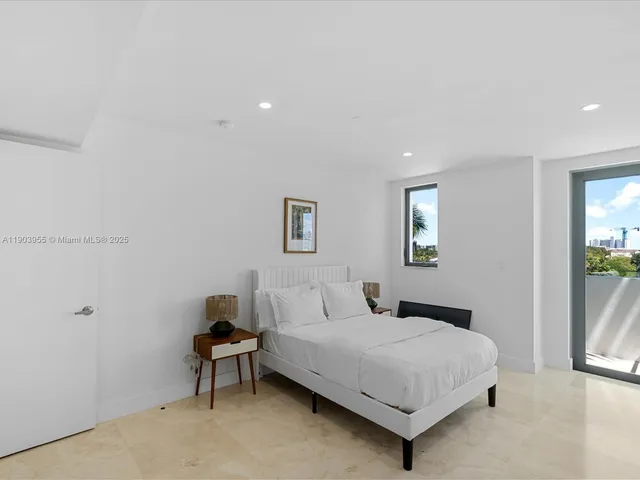 a bedroom with a bed and a table