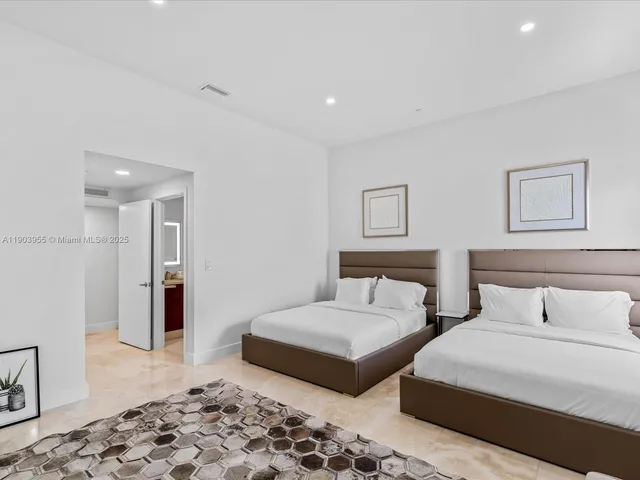 a bedroom with furniture and wooden floor