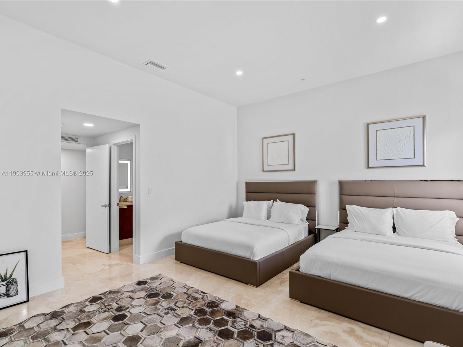 155 North Shore Drive, Unit 1553 Miami Beach, FL 33141 - Photo 28 of 48 a bedroom with furniture and wooden floor