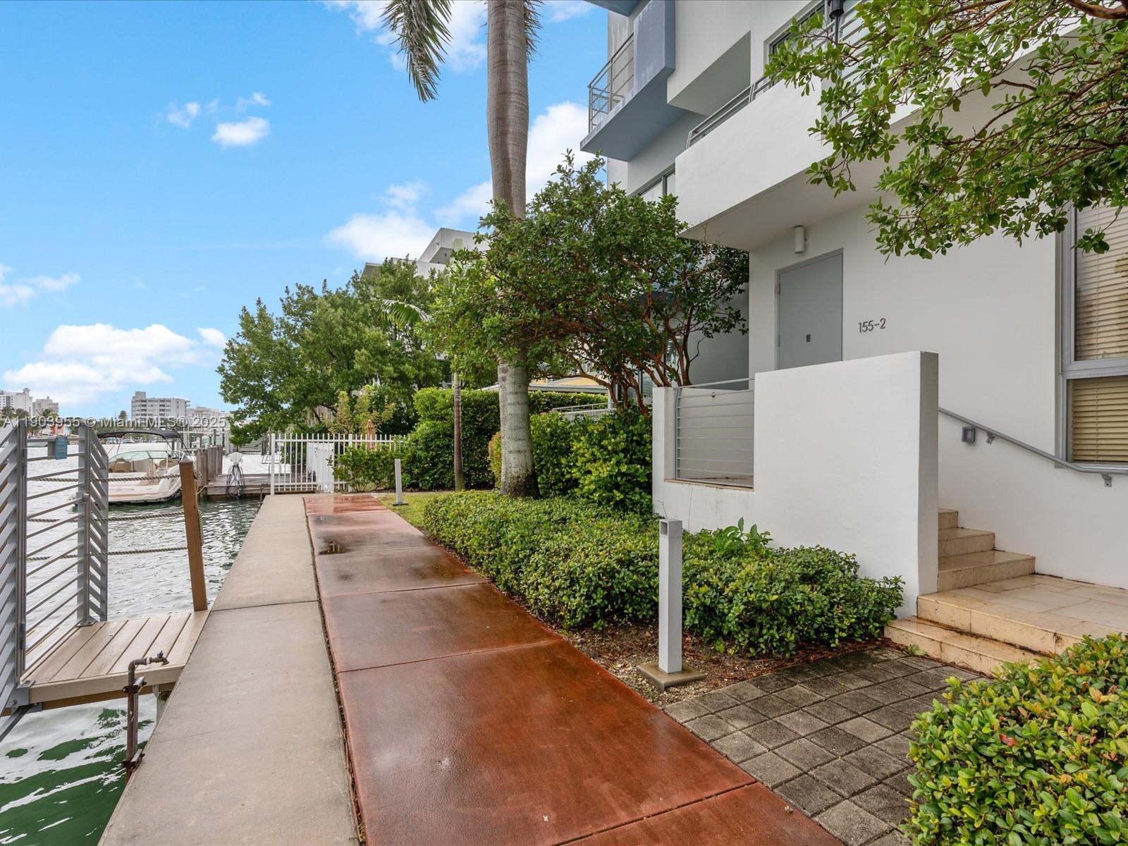 155 North Shore Drive, Unit 1553 Miami Beach, FL 33141 - Photo 3 of 48 a view of backyard with outdoor seating and plants