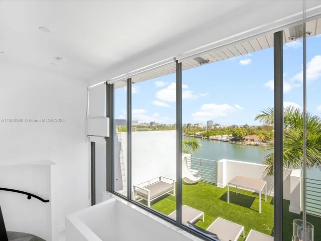 a room with a large window and an outdoor view