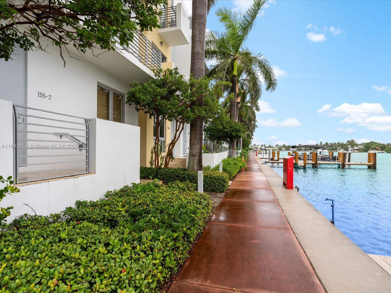 155 North Shore Drive, Unit 1553 Miami Beach, FL 33141 - Photo 4 of 48 a view of a pathway with a yard