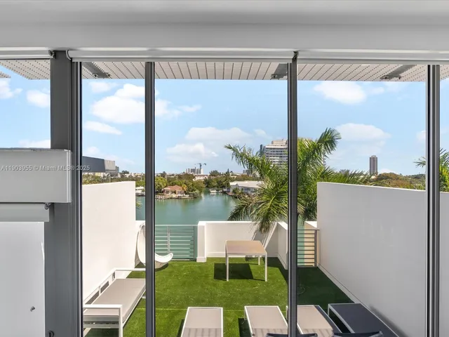 a view of a balcony with furniture