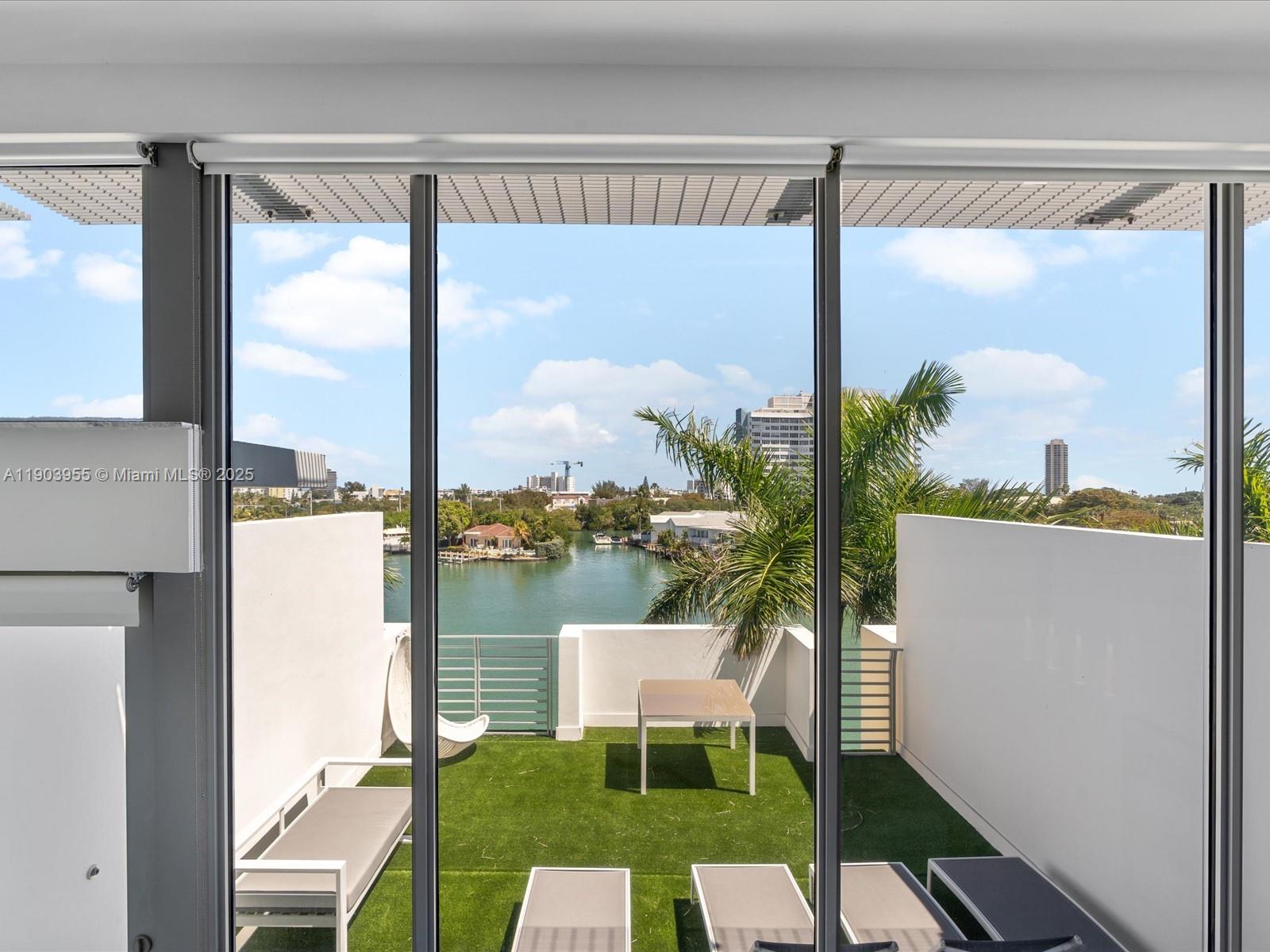 155 North Shore Drive, Unit 1553 Miami Beach, FL 33141 - Photo 43 of 48 a view of a balcony with furniture