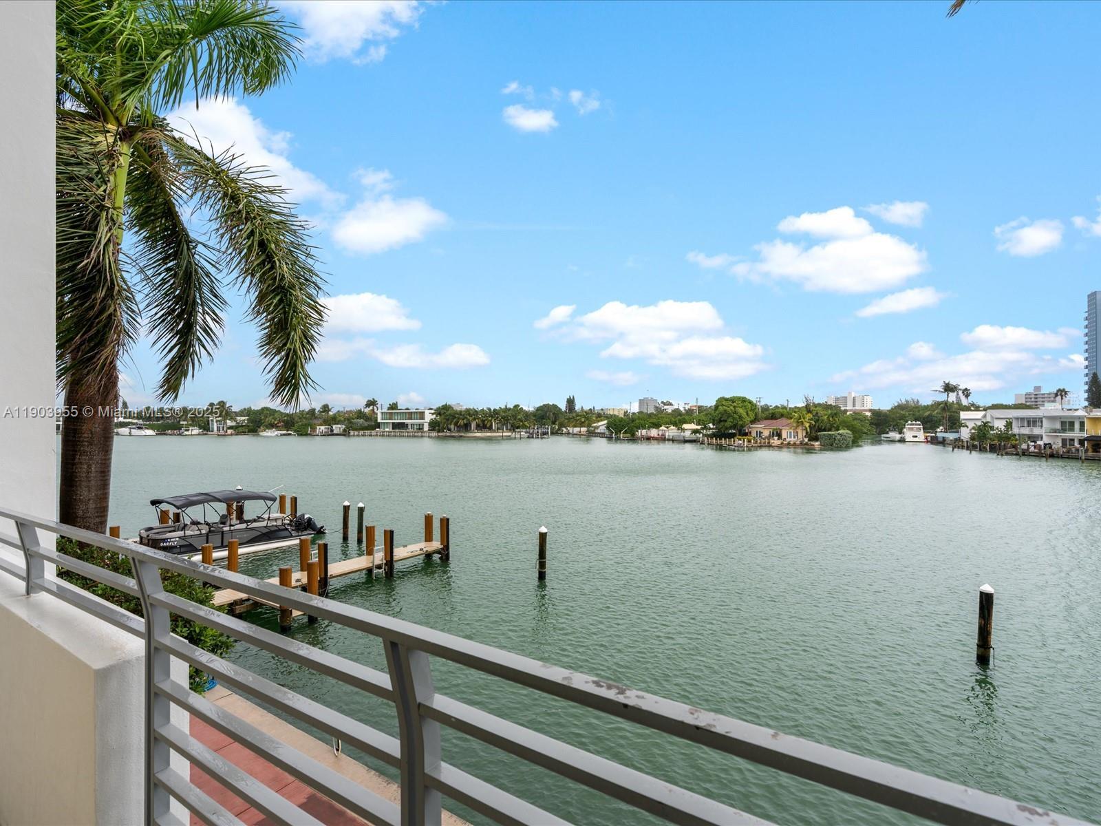155 North Shore Drive, Unit 1553 Miami Beach, FL 33141 - Photo 48 of 48 a view of a lake with a lawn chairs
