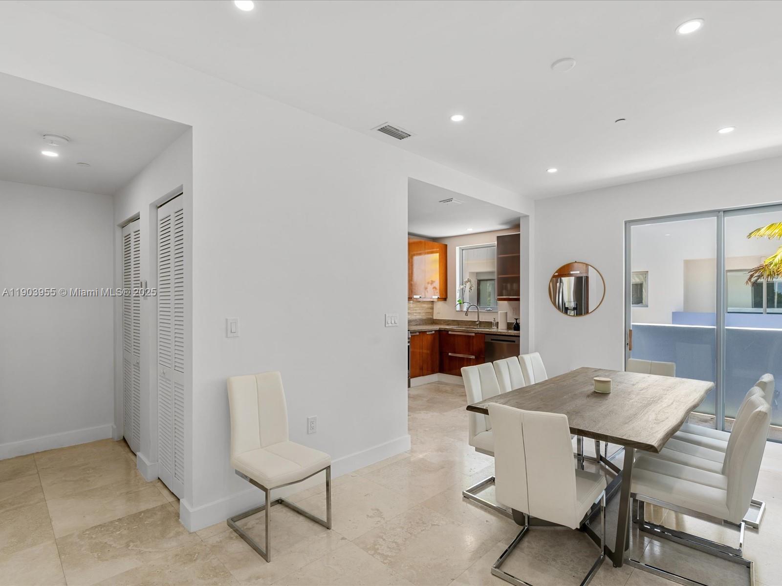 155 North Shore Drive, Unit 1553 Miami Beach, FL 33141 - Photo 9 of 48 a view of a dining room with furniture and window